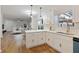 Bright, modern kitchen with quartz countertops, stainless steel sink, and white cabinets at 139 Dahlia Nw Ave, Atlanta, GA 30314