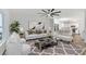 Bright living room featuring modern decor, a ceiling fan, and an open floor plan at 139 Dahlia Nw Ave, Atlanta, GA 30314