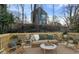 Cozy outdoor patio with comfortable seating and views of the backyard at 139 Dahlia Nw Ave, Atlanta, GA 30314