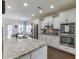 Bright kitchen showcasing granite countertops, stainless steel appliances and modern cabinetry at 2225 Independence Ln, Buford, GA 30519