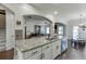 Kitchen island featuring granite countertops, stainless steel appliances and a breakfast bar at 2225 Independence Ln, Buford, GA 30519