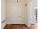 Traditional foyer features hardwood floors, paneled walls, and a stylish light fixture at 2836 Alpine Ne Rd, Atlanta, GA 30305