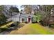 Charming home featuring a red front door, bay window, and a lush green lawn at 2836 Alpine Ne Rd, Atlanta, GA 30305