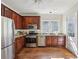 Cozy kitchen featuring stainless steel appliances, granite countertops, and ample cabinet space at 2836 Alpine Ne Rd, Atlanta, GA 30305