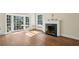 Spacious living room with hardwood floors, large windows and fireplace at 2836 Alpine Ne Rd, Atlanta, GA 30305