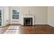 Inviting living room with beautiful hardwood floors, large windows, and a classic fireplace at 2836 Alpine Ne Rd, Atlanta, GA 30305