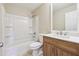 Bathroom featuring a bathtub, toilet, and a vanity with wood cabinets at 3640 Barbara Dr, Douglasville, GA 30135