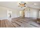 Bright and open living room features new vinyl floors, vaulted ceiling, and a view of the kitchen at 3640 Barbara Dr, Douglasville, GA 30135