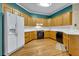 Bright kitchen featuring wooden cabinetry, white countertops, and modern appliances at 9272 Fairgreen Ct, Jonesboro, GA 30236