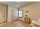 Well-lit room with luxury vinyl plank flooring, closet and a cute cabinet with baskets for storage at 1676 Charcoal Ives Rd, Lawrenceville, GA 30045