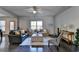 Bright living room with hardwood floors, modern furniture, and plenty of natural light at 1676 Charcoal Ives Rd, Lawrenceville, GA 30045