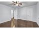 Bedroom with dark wood floors, ceiling fan, and access to multiple rooms for flexible living at 1747 Parkhill Dr, Decatur, GA 30032