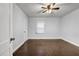 Bedroom with hardwood floors, neutral walls, ceiling fan, and natural light at 1747 Parkhill Dr, Decatur, GA 30032