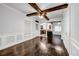 Dining area featuring wood beam ceiling and hardwood floors. View to kitchen at 1747 Parkhill Dr, Decatur, GA 30032