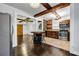 Open kitchen and dining area featuring stainless steel appliances, brick accents, and an eat-in island at 1747 Parkhill Dr, Decatur, GA 30032