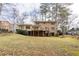 Expansive lush backyard with a well-maintained lawn, deck, and mature trees at 1958 Starfire Ne Dr, Atlanta, GA 30345