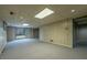 Finished basement space with sliding glass doors to the backyard and neutral carpet at 1958 Starfire Ne Dr, Atlanta, GA 30345