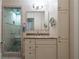 Bathroom featuring granite countertops, tiled floors, and a glass enclosed shower at 1958 Starfire Ne Dr, Atlanta, GA 30345