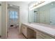 Bathroom with a large vanity, ample lighting and a view to the toilet and shower at 1958 Starfire Ne Dr, Atlanta, GA 30345