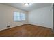 Bedroom with hardwood floors, standard lighting and a closet at 1958 Starfire Ne Dr, Atlanta, GA 30345