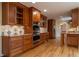 Spacious kitchen featuring stainless steel appliances, custom cabinets, granite countertops and hardwood floors at 1958 Starfire Ne Dr, Atlanta, GA 30345