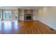 Inviting living room featuring a brick fireplace with built-in shelves and hardwood floors at 1958 Starfire Ne Dr, Atlanta, GA 30345