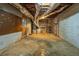 Unfinished basement space with exposed ductwork and concrete flooring at 1958 Starfire Ne Dr, Atlanta, GA 30345