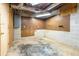 Unfinished basement with concrete floor and walls, electrical panel, and pegboard at 1958 Starfire Ne Dr, Atlanta, GA 30345