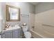 Clean bathroom with tub-shower, single vanity, and modern fixtures at 2102 Lenoa Ln, Austell, GA 30106