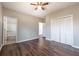 Large bedroom with hardwood floors, closet, and access to the bathroom at 2102 Lenoa Ln, Austell, GA 30106