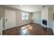 Inviting living room featuring hardwood floors, a decorative fireplace, and plenty of natural light at 2102 Lenoa Ln, Austell, GA 30106