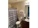 Clean bathroom features a shower with a full-length striped shower curtain and modern fixtures at 5301 Fairington Club Dr, Lithonia, GA 30038