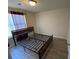 A bedroom featuring vinyl floors and window with dark curtains at 5301 Fairington Club Dr, Lithonia, GA 30038