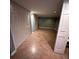 Finished basement space with tile flooring and storage closets at 6542 Cherry Tree Ln, Atlanta, GA 30328