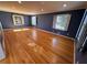 Living room with large windows with hardwood floors and neutral paint at 6542 Cherry Tree Ln, Atlanta, GA 30328