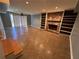 Finished basement area with a fireplace, built-in shelving, and sliding glass doors at 6542 Cherry Tree Ln, Atlanta, GA 30328