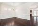 Beautiful dining room with hardwood floors and view into the kitchen at 11330 Easthaven Pl, Johns Creek, GA 30097