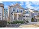 Traditional brick home featuring a two-car garage and welcoming front porch at 11330 Easthaven Pl, Johns Creek, GA 30097