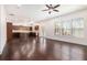 Open concept living room and kitchen featuring hardwood floors and lots of windows at 11330 Easthaven Pl, Johns Creek, GA 30097