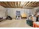 Unfinished basement featuring concrete floors, exposed ceiling insulation, and unfinished walls at 1406 Winston Pl, Decatur, GA 30033