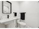 Clean bathroom with a floating sink, modern fixtures and a towel rack at 1406 Winston Pl, Decatur, GA 30033