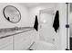 Stylist bathroom with black and white tile, a modern vanity, and a glass-enclosed shower at 1406 Winston Pl, Decatur, GA 30033