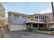 Home exterior with a two-car garage and a private balcony above the entrance at 1406 Winston Pl, Decatur, GA 30033