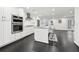 Bright kitchen with stainless steel appliances, granite countertops and dark hardwood floors at 1406 Winston Pl, Decatur, GA 30033