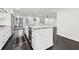 The kitchen features an island with stainless steel appliances, granite countertops and dark hardwood floors at 1406 Winston Pl, Decatur, GA 30033