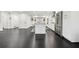 Bright kitchen with stainless steel appliances, island with granite countertop, and white cabinetry at 1406 Winston Pl, Decatur, GA 30033