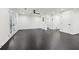 Spacious living room with dark hardwood floors, natural light, and a modern ceiling fan at 1406 Winston Pl, Decatur, GA 30033