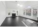 Bright living room with vaulted ceiling, large windows and fireplace at 1406 Winston Pl, Decatur, GA 30033