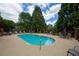Relaxing pool area with lounge chairs and tables, perfect for outdoor enjoyment at 1406 Winston Pl, Decatur, GA 30033