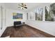 Relaxing porch with wooden floors, a ceiling fan, and a window with a tree view at 1406 Winston Pl, Decatur, GA 30033
